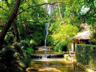 Small waterfall lush forest house - impressionist free wallpaper