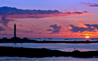Lighthouse rocky shore sunset clouds 12 - a rocky shore free wallpaper