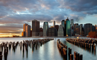 City skyline water clouds bridge - a cloudy sky in the background free wallpaper