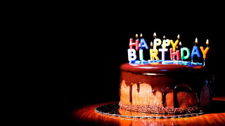 Chocolate birthday cake lit candles 3 - a wooden table free wallpaper