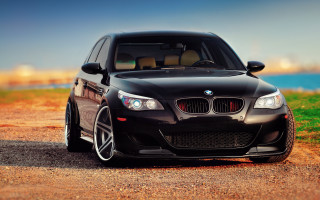 Black car dirt road water 2 - a grassy area free wallpaper
