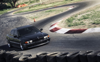 Black car race track flags - the other side of the road free wallpaper