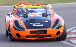 Orange racecar frontview racetrack numbered - front view free wallpaper