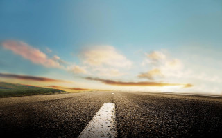 Road clouds sunset cityscape mountains - a sun setting free wallpaper