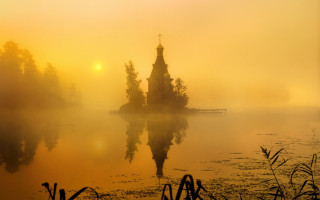 Small island lake church sunset - the sun setting free wallpaper