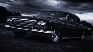 Classic car skull hood gothic - a field under a cloudy sky free wallpaper