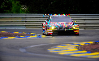 Colorful pixel art racecar on - a race track free wallpaper