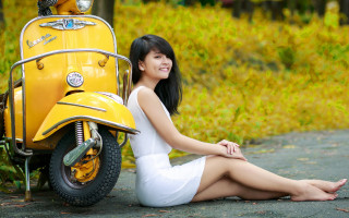 Woman sitting yellow scooter autumn - a basket free wallpaper