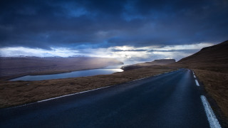 Mountain lake road cloudy sky 2 - a mountain in the distance free wallpaper
