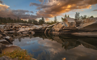 Lake rocks trees cloudy sky - naturalism free wallpaper