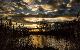 Lake sunset clouds grass cityscape 2 - a sunset in the background free wallpaper