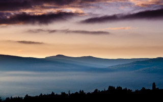 Mountain range clouds sunset trees - a sunset in the background free wallpaper