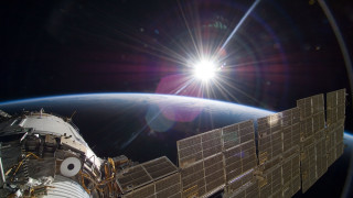 Sunlight space station earth cityscape - over the earth free wallpaper