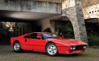 Red sports car brick building - underneath free wallpaper