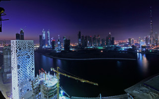 City skyline night water bridge 8 - a large city in the background free wallpaper
