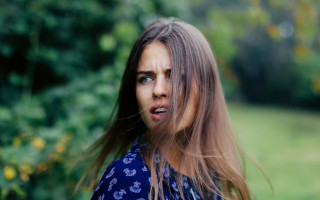 Woman longhair surprised green background - look free wallpaper for desktop