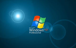 Blue background windows xp logo 4 - a bright sun in the background free wallpaper