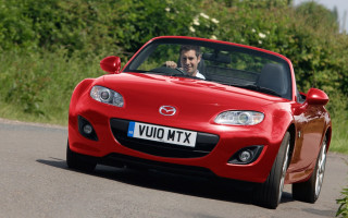 Man driving red sports car 2 - andrew bell free wallpaper