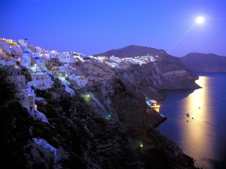 Cliff town night fullmoon city - a view of a town free wallpaper