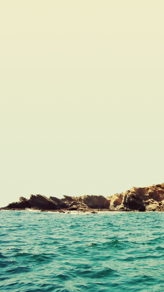 Surfboard ocean rocky island lighthouse - a person riding free wallpaper