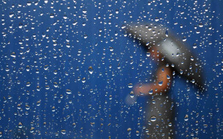 Rainy blue wall umbrella cherry - a person holding free wallpaper