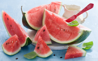 Watermelon slices spoon milk pitcher - a blue surface free wallpaper for desktop