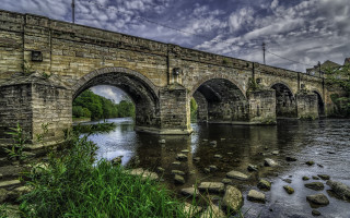 Stone bridge ruins overgrown cityscape - alexander johnston free wallpaper