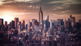 City skyline tall building cloudy - a cloudy sky in the background free wallpaper