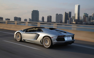 Silver sports car city skyline - near free wallpaper for desktop