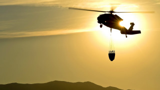 Helicopter sunset silhouette ocean rimlight - a helicopter free wallpaper