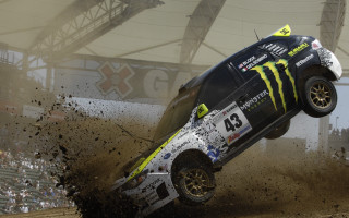 Monster truck jumping dirt stadium - a monster truck free wallpaper