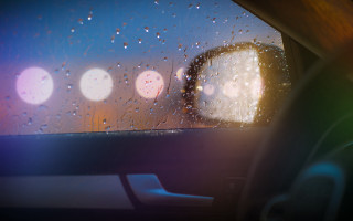 Car dashboard raindrops streetlight night - beeple free wallpaper