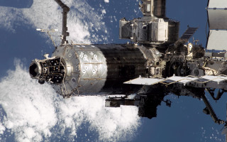 Space shuttle clouds building night 2 - a space shuttle free wallpaper