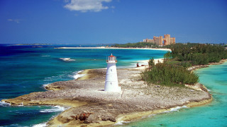 Lighthouse island ocean city boat - an island in the middle of the ocean free wallpaper