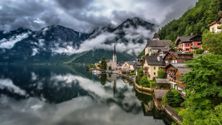 Lake mountains houses cloudy sky 2 - a church free wallpaper