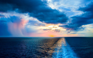 Boat ocean sunset clouds city - impressionist free wallpaper