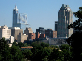 City skyline trees blue sky - free city wallpaper