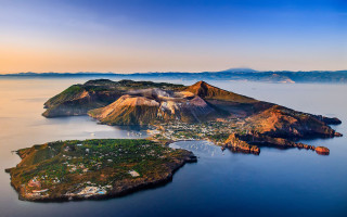 Small island town mountains aerial - correggio free wallpaper