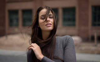 Woman long hair building background - flowing hair free wallpaper