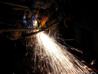 Person welding metal sparks light - a person free wallpaper