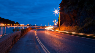 Night street mountain city lights - a matte painting free wallpaper for desktop