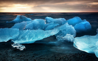 Icebergs sunset ocean beach landscape - a group of icebergs free wallpaper