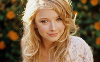 Blonde woman orange flowers portrait - a white top free wallpaper