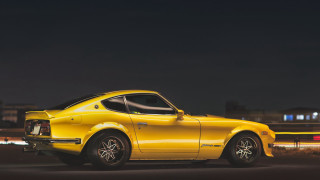 Yellow sports car night city - a parking lot free wallpaper