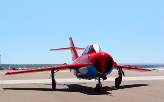 Red blue plane runway sky - an airport free wallpaper