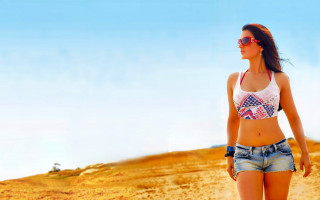 Desert beach woman denim shorts - a dirt road in the desert free wallpaper