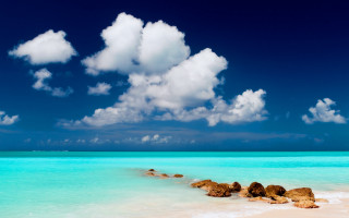 Beach rocks clouds blue sky - a few rock free wallpaper