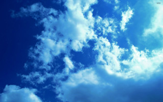 Plane flying blue cloudy sky - free sky wallpaper