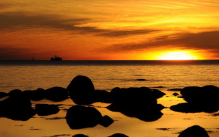 Sunset water rocks ship clouds - the distance free wallpaper