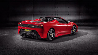Red sports car dark room 11 - a black wall behind free wallpaper